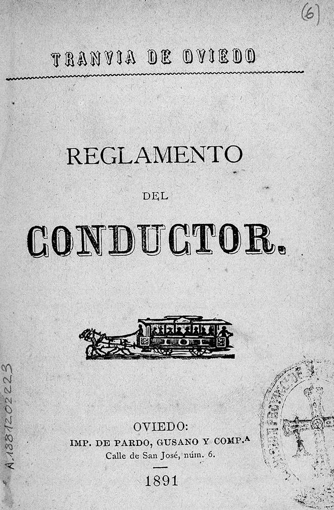 Altes Buch mit dem Titel "Reglamento de Conductor" und einer Zeichnung eines Zuges auf dem Titelbild und einem Stempel auf der rechten Seite.