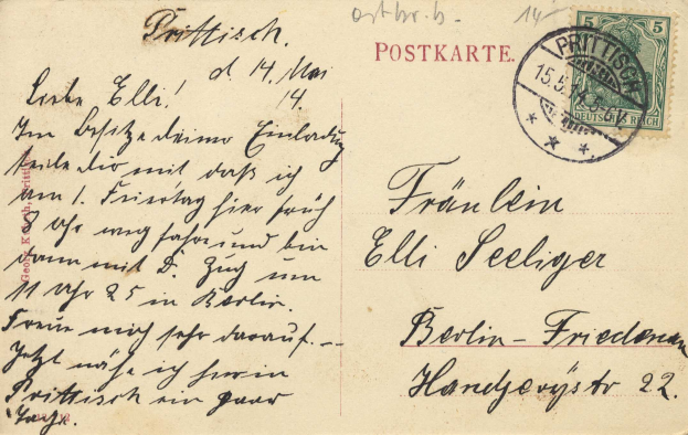Eine alte deutsche Postkarte von Berlin nach Freiburg mit handgeschriebenem Text und einer Briefmarke.