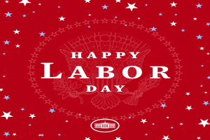 Ein Plakat mit 'Happy Labor Day' in fetter weißer Schrift auf einem hellroten Hintergrund, umgeben von farbigen Sternen verschiedener Größen.