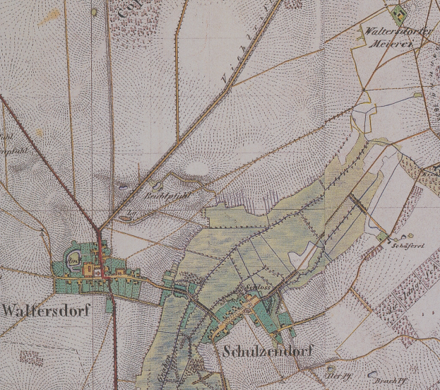Ein detaillierter alter Stadtplan von Wallersdorf, Deutschland, der Straßen, Gebäude und andere Merkmale mit Textanmerkungen zeigt.