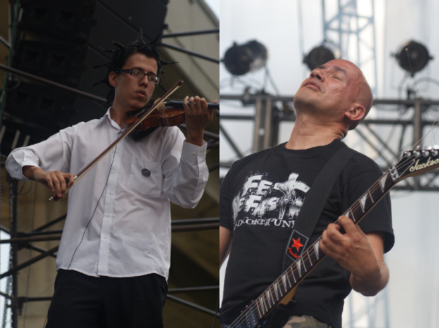 Zwei Personen, die stehen und Musikinstrumente spielen