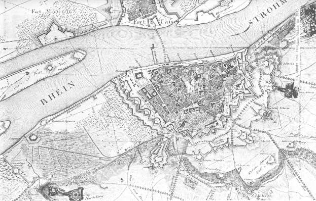 Eine detaillierte schwarz-weiße Karte der Stadt Rhein, die Straßen, Gebäude und andere Merkmale zeigt, mit Textanmerkungen.